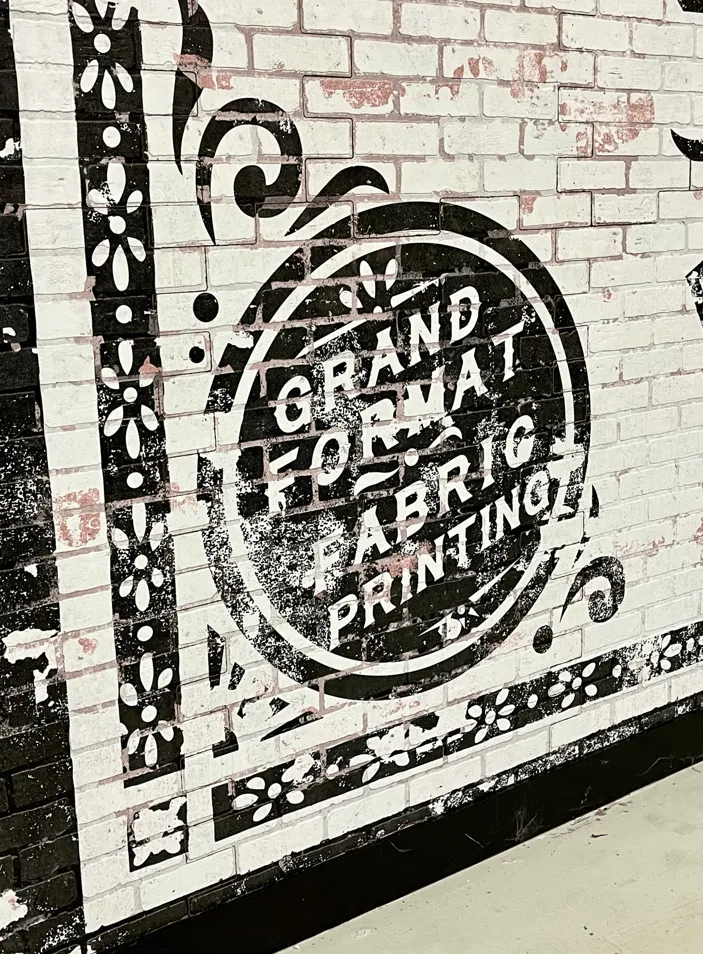 Signage Featuring DPI Faux Brick Paneling