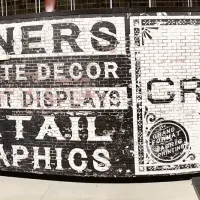 Signage Featuring DPI Faux Brick Paneling